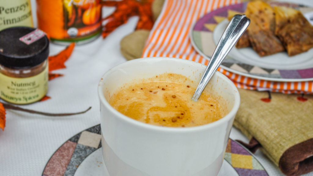 Pumpkin Chai Tea Latte in a mug with spoon.
