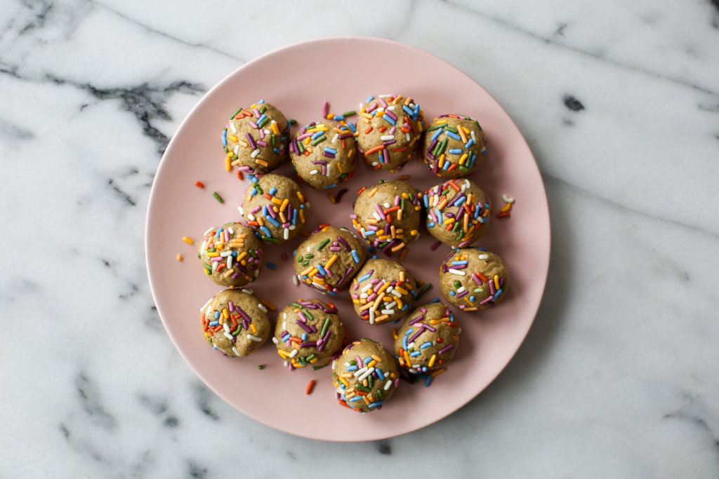 Photo of birthday cake protein bites on a plate