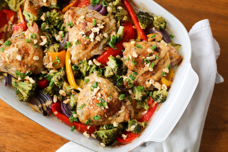 One-pan crispy peanut chicken thighs in a serving dish