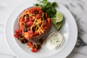 Photo of a taco-stuffed sweet potato on a plate