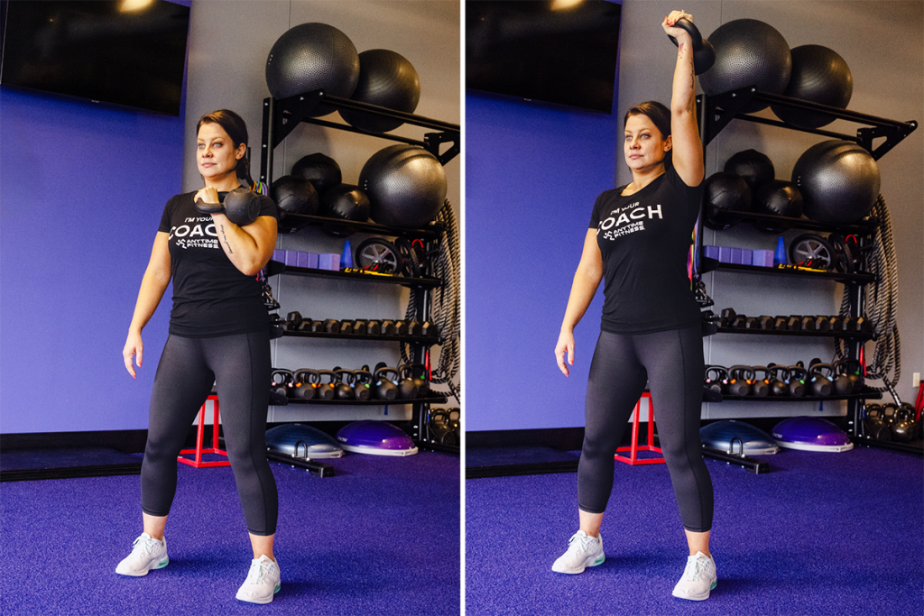 Coach Heather demonstrating a single-arm overhead press with a kettlebell.