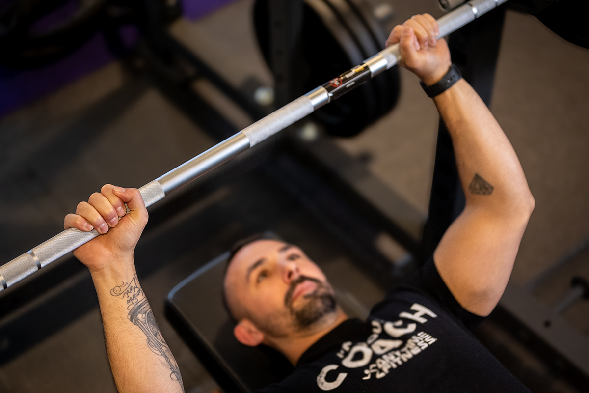 Anytime Fitness Coach Mike demonstrating how to bench press with the correct grip.