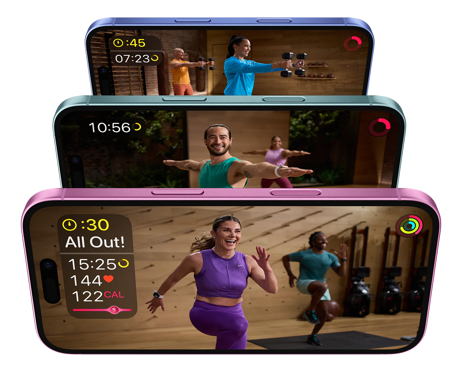 Three iPhones with Apple Fitness+ workout videos playing.